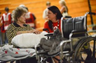 June 26, 2016. Charleston, West Virginia. Floods. Lucille Chandler speaks with American Red Cross staff Joanna King. 90-year-old Lucille Chandlers home in Clendenin was flooded on Thursday. She and her daughter were rescued by a neighbor who had a boat. He transported them to a nearby church that was partially flooded, but where the top floor was still dry and used by local residents seeking shelter. Yesterday she was brought to the Capital High School gymnasium in Charleston which has been turned into an Red Cross shelter. I really appreciate what the Red Cross has done for me, explains Lucille, I have a problem walking and the Red Cross volunteers bring me around in a wheelchair. The next step for Lucilles Red Cross assistance will be handled by caseworkers. Photo by Daniel Cima for the American Red Cross