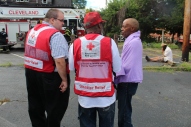 Red Cross Disaster Program Manager Jeremy Bayer, volunteer Walter Reddick and client Therens Vitanzan