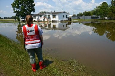 September 2, 2017. Wharton, Texas. A Red Cross worker assesses damage and standing water levels in Wharton, Texas nine days after Hurricane Harvey made impact in Texas. Photo by Daniel Cima for the American Red Cross